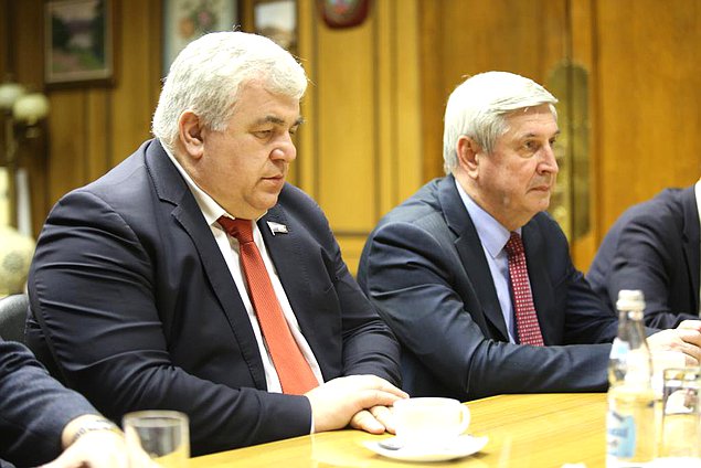 Member of the Committee on Issues of the Commonwealth of Independent States and Contacts with Fellow Countrymen Kazbek Taisaev and First Deputy Chairman of the State Duma Ivan Melnikov